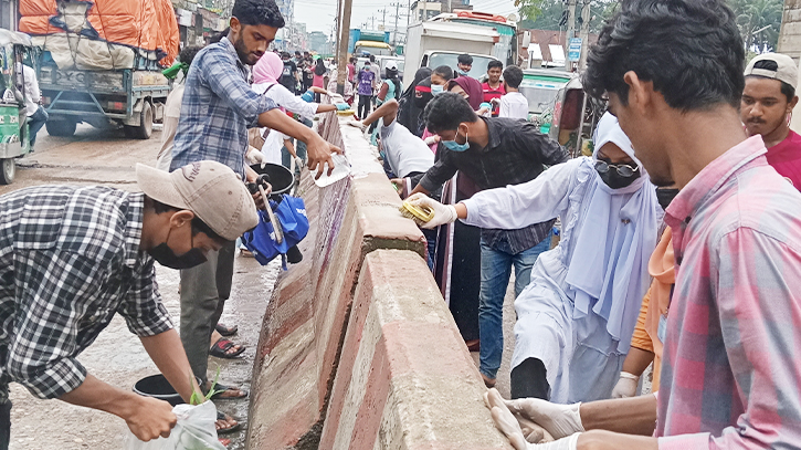 Female Students cleaning four lane road in Noakhali