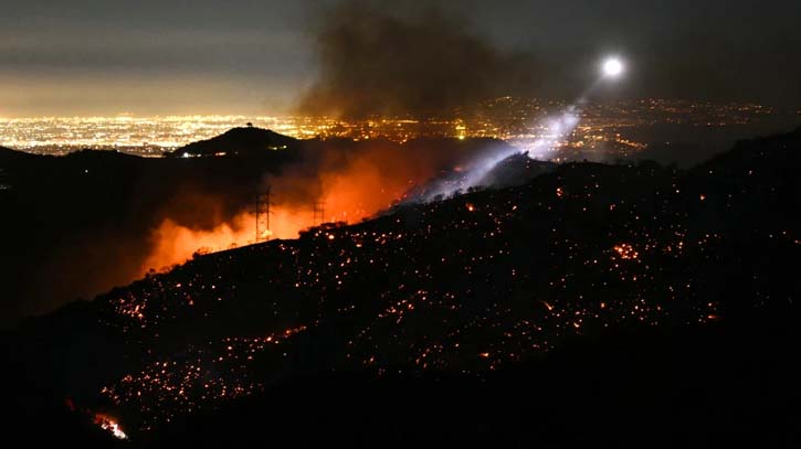 Firefighters battle to maintain the upper hand on a huge fire north of Los Angeles