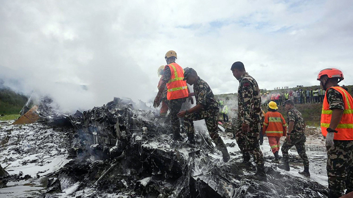 18 dead after plane slips off runway and crashes at Nepal airport