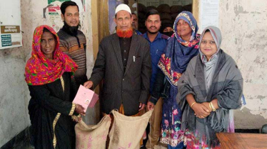 Distribution of rice to 410 beneficiary women in Paikgacha