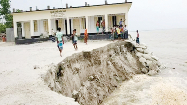 Erosion endangers village, school put up for sale