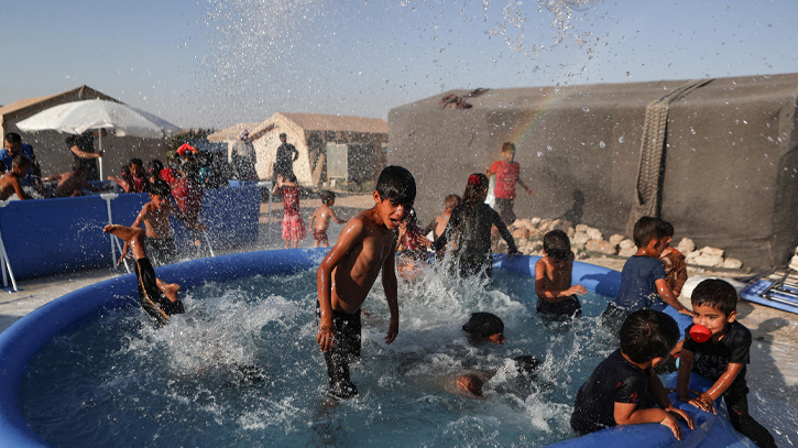 Mobile pools offer relief from heat to children in Syria camps